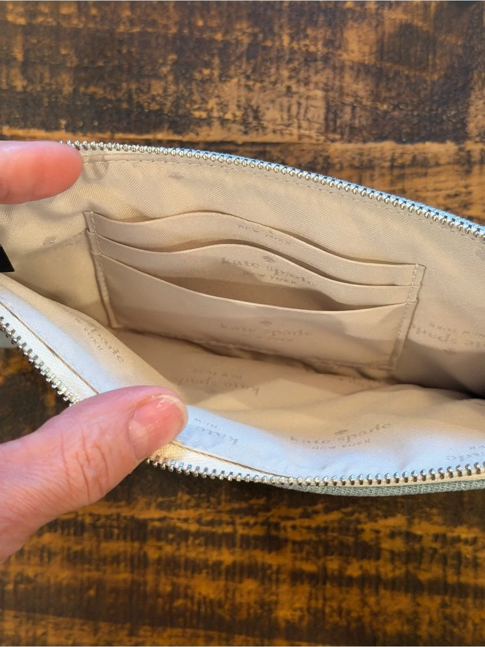 kate spade light denim wristlet with cream strap